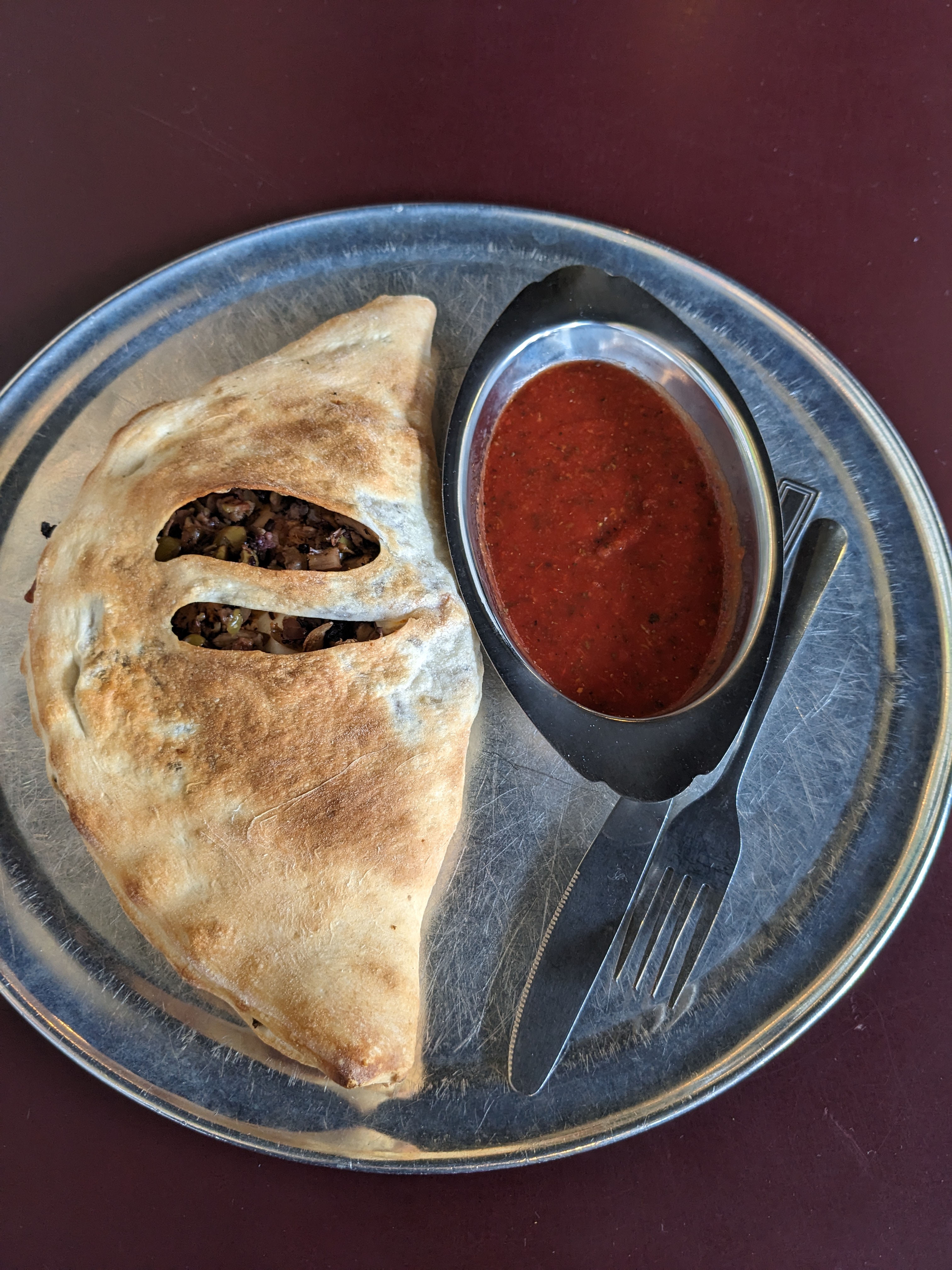 Mushroom, Sausage, and Muffaletta Salad calzone